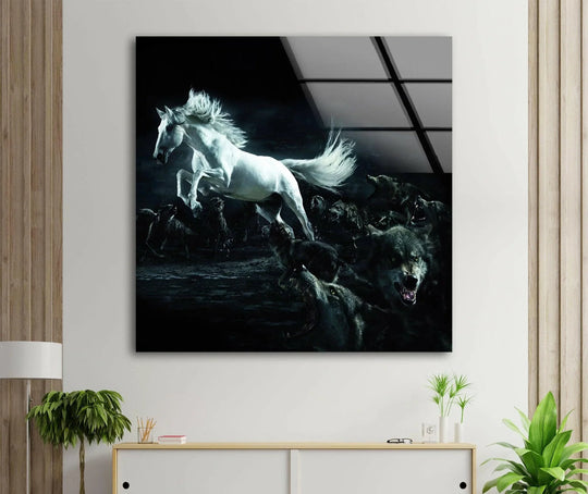 Animal glass wall art shows a white horse pursued by wolves and dramatic decor and is intense animal decor and modern wall art