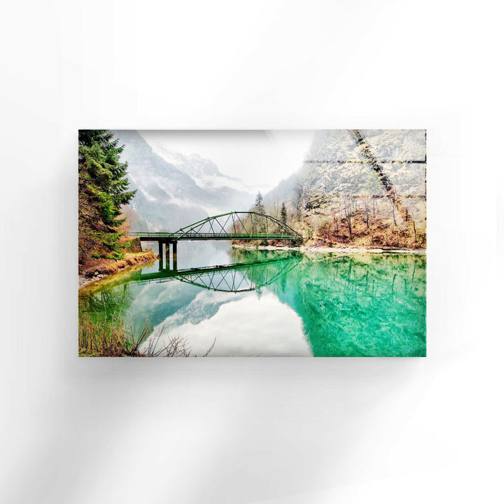 Landscape art for sale depicting a peaceful riverside bridge surrounded by nature.
