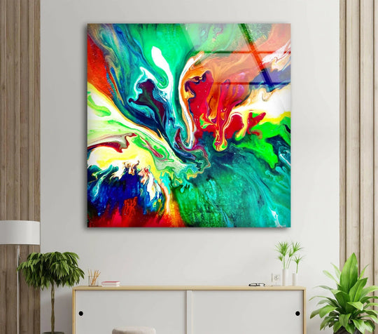 A still abstract glass art painting with flowing green and red hues creates a serene focal point.