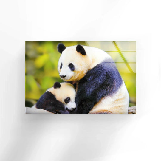 A mother panda and her cub are bathed in soft light and shadow on this stunning glass art.