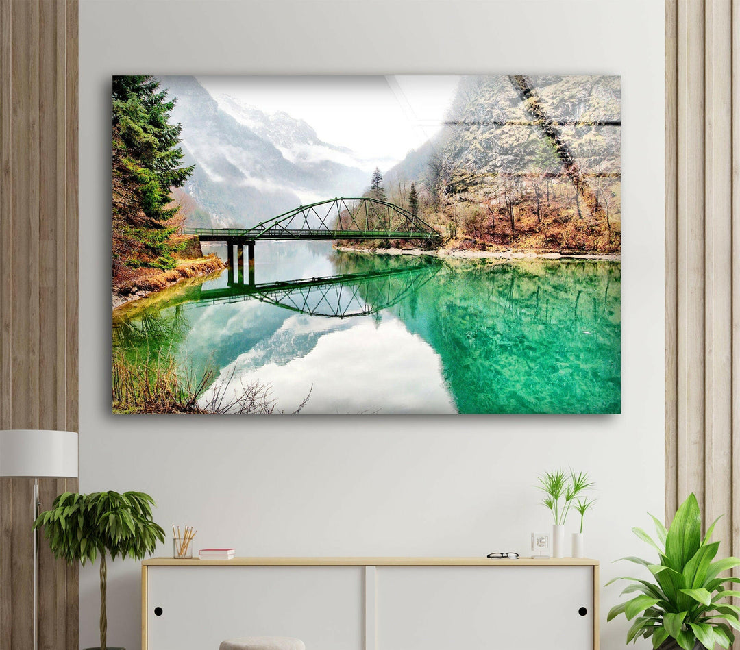 Nature art prints showcasing a lush forest, a calm river, and a rustic bridge.

