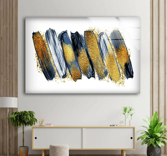 Bold navy and gold brushstrokes create a dynamic visual rhythm in this abstract glass wall art decor.