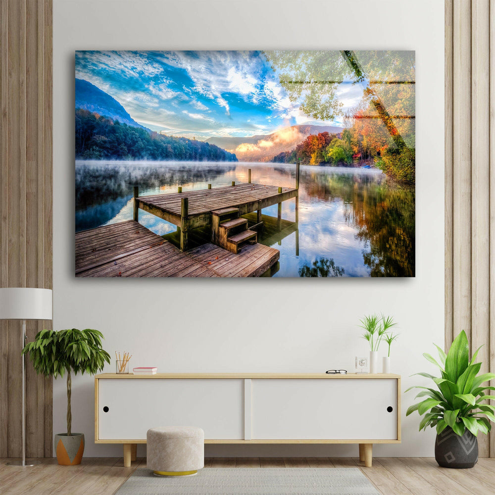 Serene landscape wall art featuring a rustic wooden dock surrounded by autumn trees and calm waters.
