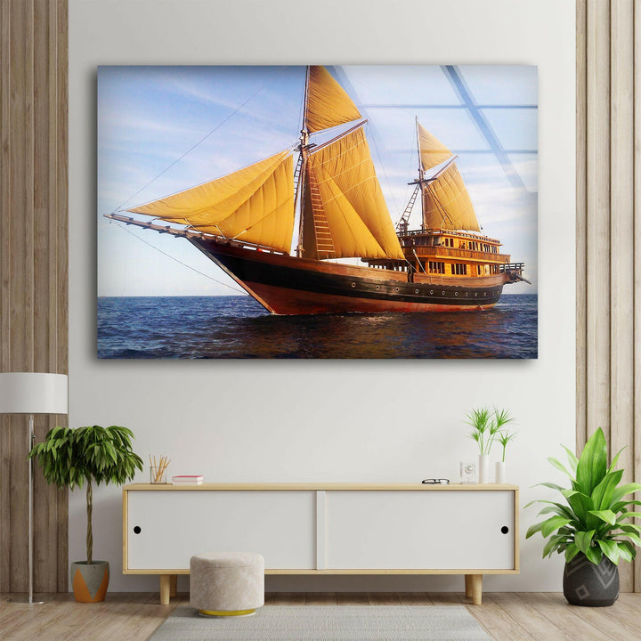 Elegant sailing vessel gliding over the ocean at dusk, illuminated by warm sunlight.
