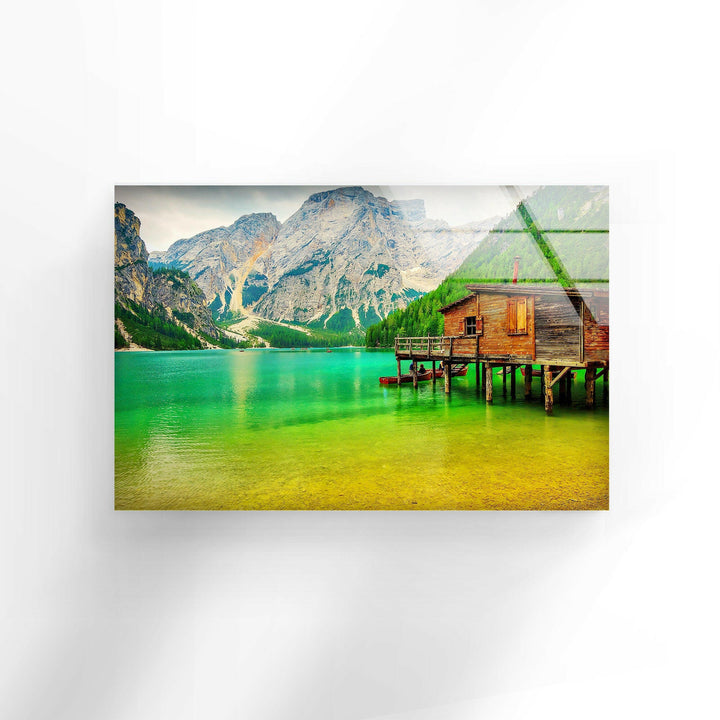 Landscape art for sale showcasing a picturesque lake retreat with vibrant green waters.
