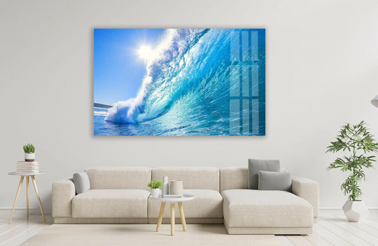 Huge ocean wave glass wall art shows a sea wave and sunlight and is ocean wave decor and stunning sea wall art for coastal decor lovers
