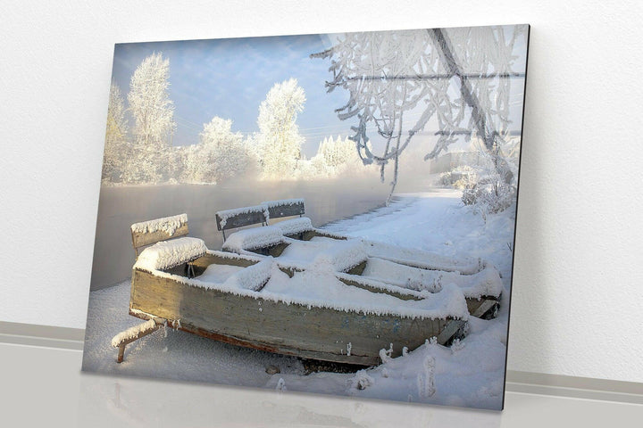 Cozy and serene winter decor featuring a frost-covered bench under icy trees.
