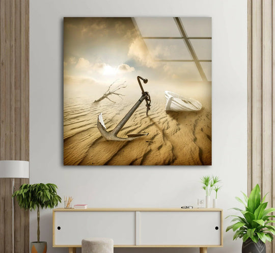 Sunlight dramatically casts shadows across a desert landscape featuring a shipwreck anchor, bringing this glass art to life.