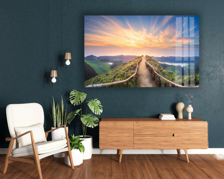 A peaceful mountain trail leading to a glowing sunrise, ideal for nature lovers.
