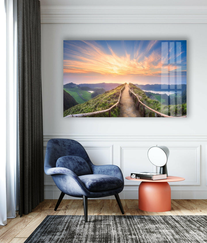 Elevated scenic view of a mountain pathway bathed in golden sunlight.
