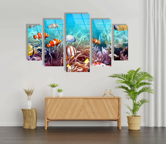 Smooth surface texture defines this 'Clownfishes On The Seabed' glass wall art, adding depth and vibrancy, making it an ideal home decor piece for a marine-themed room.