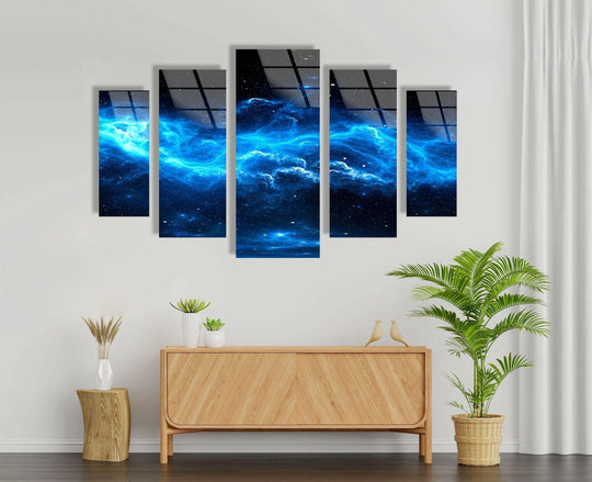 Wispy blue and white celestial clouds form an ethereal and soft nebula star galaxy across the five-panel glass wall artwork, reflected in the high-shine tempered glass.