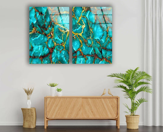 Against a crisp white background, a stylish arrangement features turquoise and gold veins marbling glass print wall art above a light wood cabinet.
