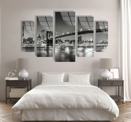 Showing the layering effect, this black and white NYC bridge landscape glass wall art uses a five-panel design to create a striking example of decorative wall art.