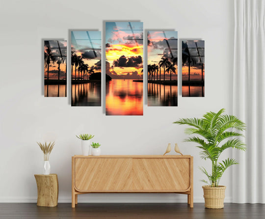 Paradise Beach Sunset Tropical Palms glass wall art shows a vibrant tropical beach sunset motif and creates a peaceful paradise scene and is coastal artwork on a white wall