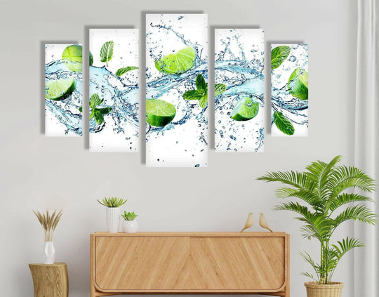 The flowing transition between the vibrant greens of fresh limes and the clear blue water creates an appealing, refreshing home decor glass wall art piece.