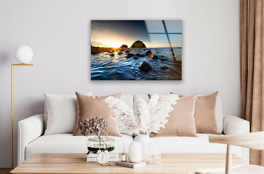 Landscape glass wall art capturing a rocky shore and sunset with artwork reflecting coast beauty and ocean scene