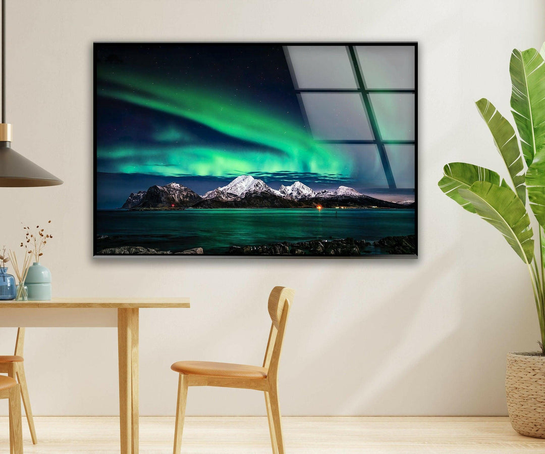 High-definition glass wall art showcasing the vibrant Northern Lights above icy peaks.
