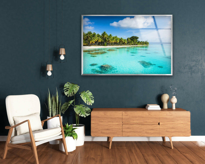 Tranquil ocean view with vibrant coral reefs and lush greenery.
