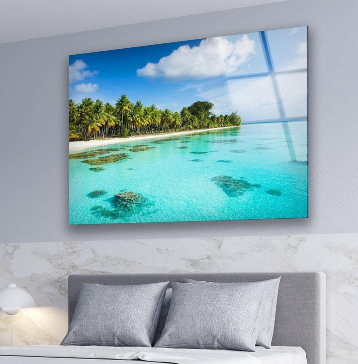 Nature-inspired wall art featuring a tropical beach with soft waves and golden sands.
