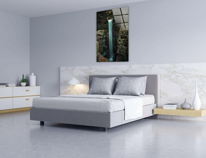 Enchanting nature scenery of a waterfall streaming down rugged rocks, ideal for home decor.
