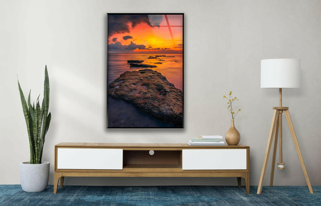 High-definition glass wall art showcasing a stunning sunset over the sea.
