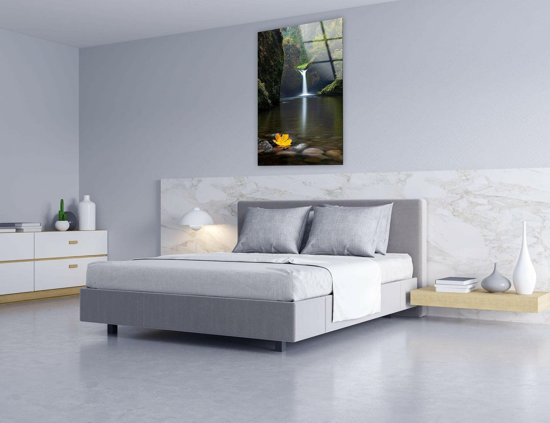 Elegant glass artwork capturing a nature retreat with a calming waterfall scene.
