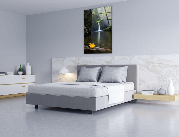 Elegant glass artwork capturing a nature retreat with a calming waterfall scene.
