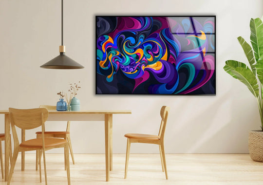 Dark indigo and deep violet tones swirl with electric blues and fiery oranges in this vibrant glass wall art.