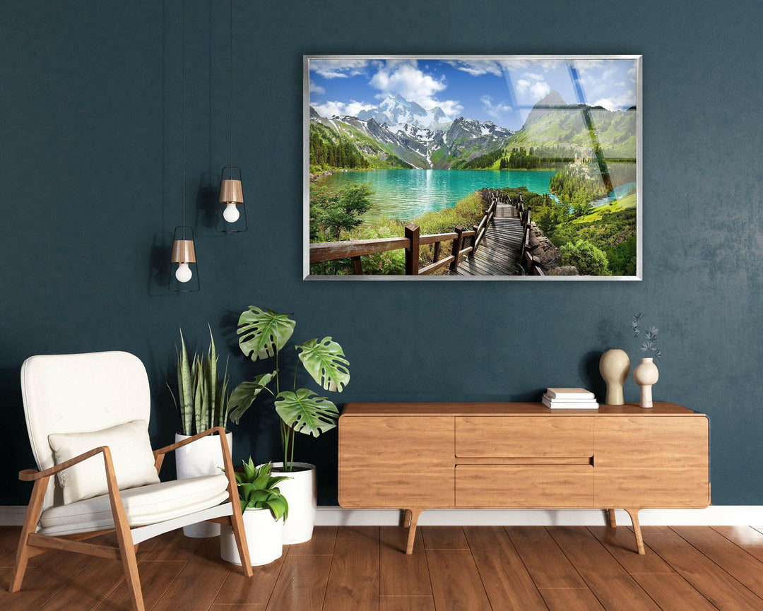 Tranquil lake scene with a stunning reflection of towering mountains.
