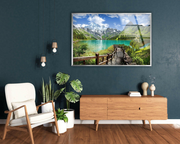 Tranquil lake scene with a stunning reflection of towering mountains.
