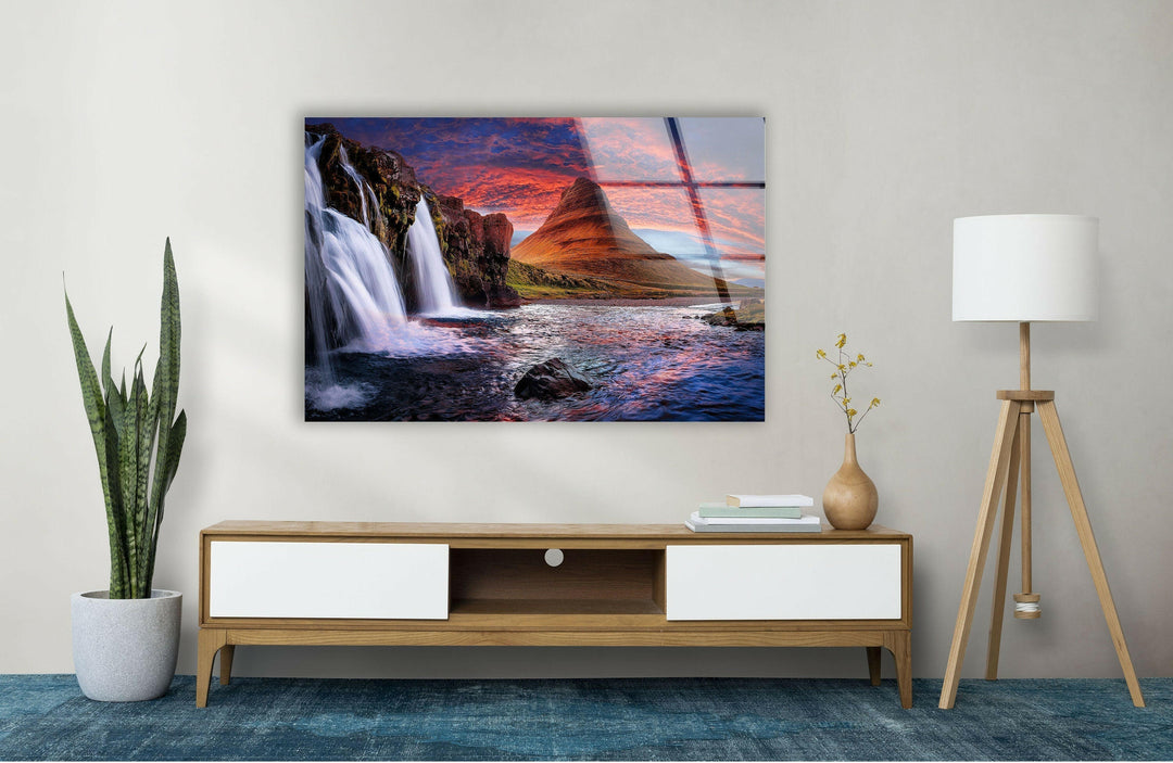 Luxury glass artwork showcasing a cascading waterfall and a fiery sunset reflection.
