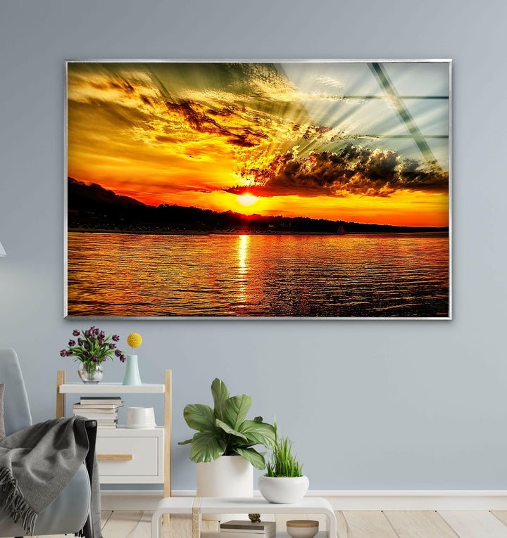 Tranquil Golden Sunset: A vivid sunset mirrored over the peaceful sea.
