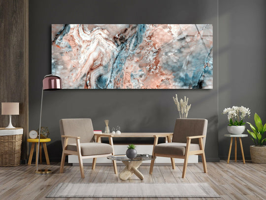 Surrounding the marble abstract painting, the dark negative space highlights the glass wall artwork's panoramic shape and textured, earthy tones of blue, white, and peach.