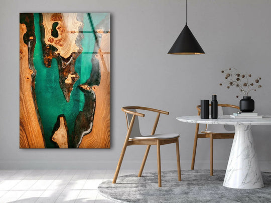Dominant emerald green and warm wood tones swirl in this abstract epoxy glass wall art.