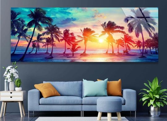 Tropical Palm Trees glass wall art features a vibrant sunset and silhouetted palms and creates a serene statement wall decor for a living room