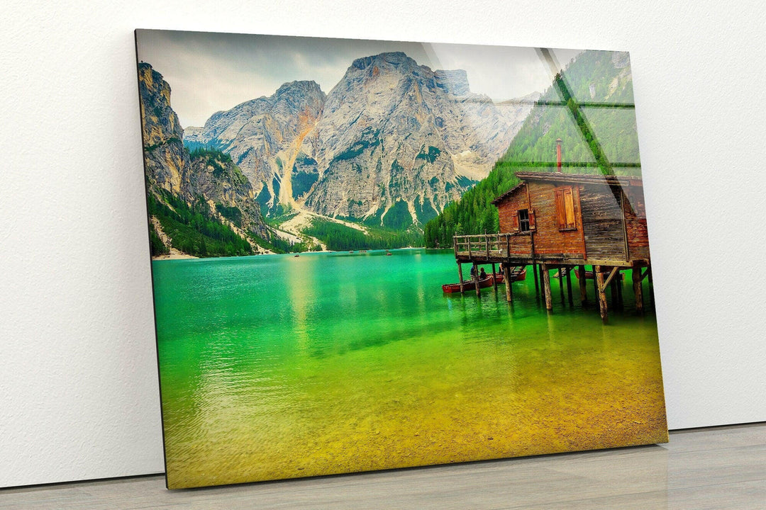Nature art prints capturing a peaceful lakeside cabin surrounded by lush greenery.
