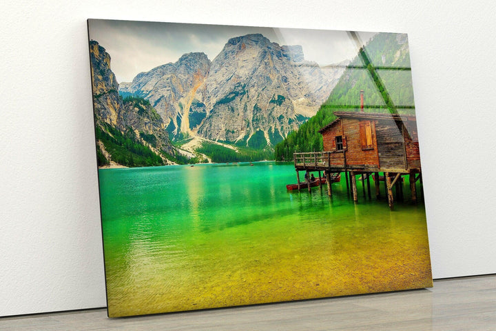 Nature art prints capturing a peaceful lakeside cabin surrounded by lush greenery.
