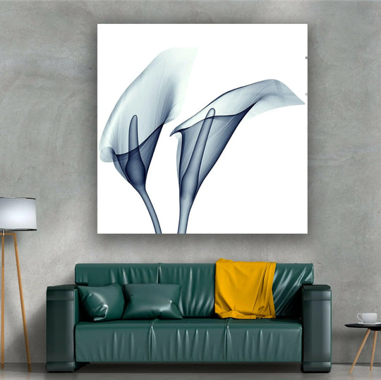 Dominant blue calla lilies grace this home decoration, showcasing ethereal floral beauty on glass.