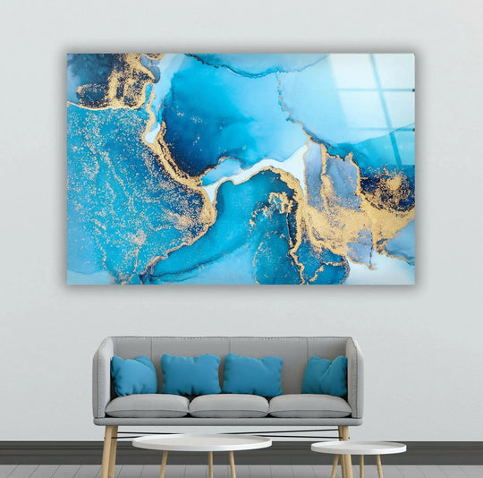 Brightest areas of luminous blue and gold swirls in abstract glass wall art.