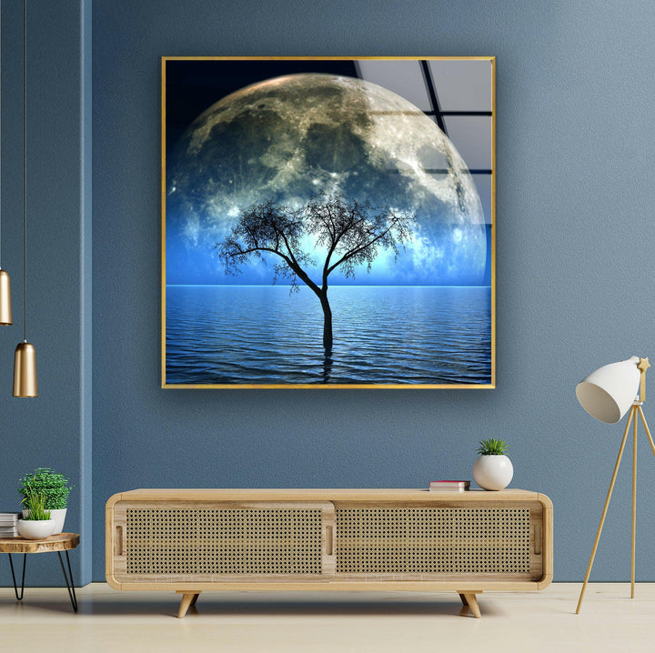 Tranquil and dreamlike glass wall art depicting a serene ocean under a glowing full moon.
