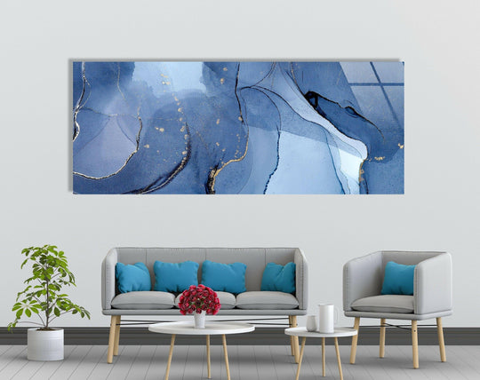 Calm and serene, the navy blue and gold foil alcohol ink wall prints evoke a sense of luxurious fluidity, enhancing the room's peaceful mood.