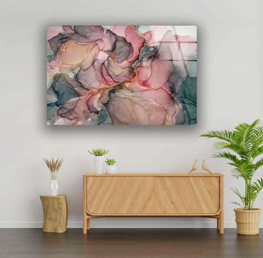 A modern living room features abstract pink and gray marble art from glass above a wooden cabinet.
