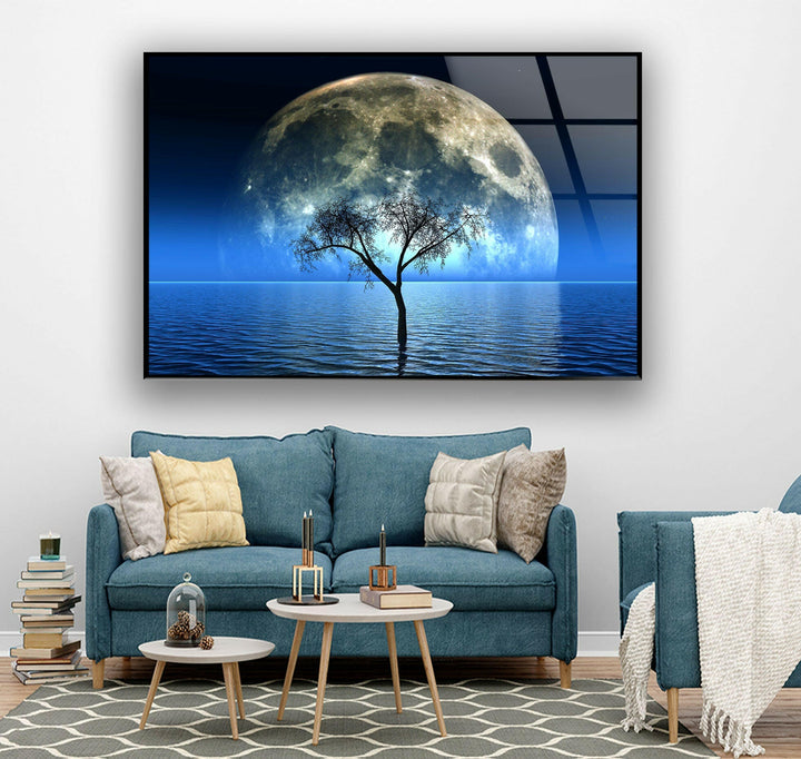 A surreal night scene of a lone tree emerging from the water under a giant moon.
