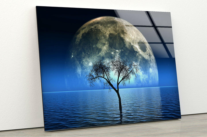 Enhance your decor with this glass wall art showcasing a lone tree under a massive moonlit sky.

