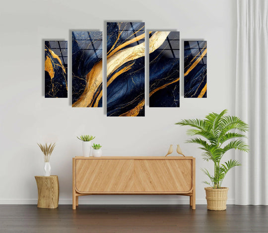 Featuring a modern background with white walls and wood furniture, the Navy Blue With Golden Veins Marble glass wall art adds luxury for your home decoration.