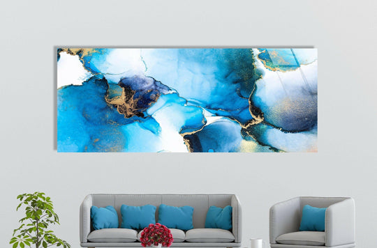 Vibrant color saturation highlights the blue and gold hues of this luxury fluid art abstract, making it one of the best glass art pieces for a modern space.