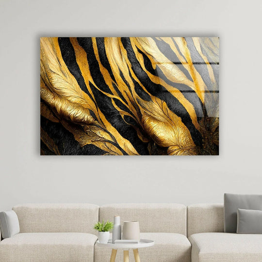A rectangular black and gold glass wall artwork featuring abstract flowing shapes and textures.