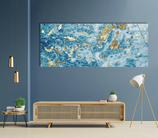 Showcasing a close-up of the Light Blue & Gold Glitter Marble Abstract glass wall art, highlighting the sleek edges and borders that enhance its modern home decor appeal.