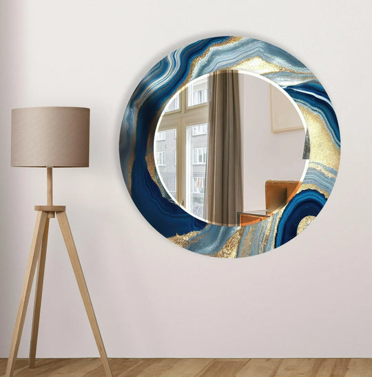 Dark Blue Golden Round Wall Mirror with an abstract blue and gold fluid artistic design a luxurious glass decor piece on a white wall